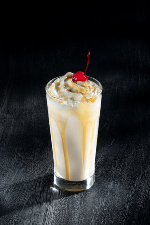 View of nice yummy milk ice cream shake on grey backの写真素材