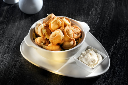 close up view of plate with dumplings on grey background.の写真素材