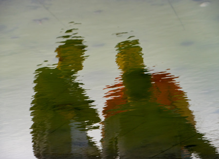 two person Reflections in the Water