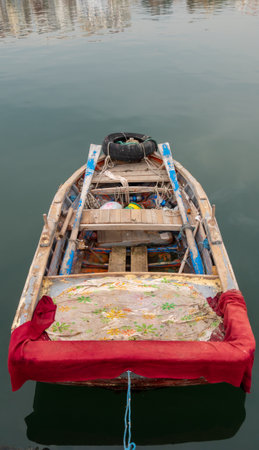 Wooden fishing boat anchored to the port in Turkey.