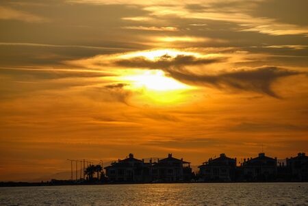 Sunset at mavisehir, part of izmir city with buildings silhouette. background.