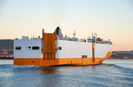 Large Roll-on roll-off RORO or ro-ro ship or oceangoing vehicle carrier ship sailing in the sea....