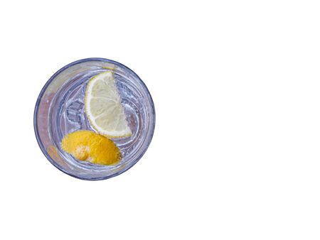 glass of sparkling water with lemon slices isolated on white. drink and refreshment concept