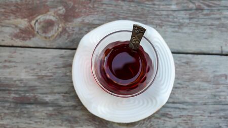 Drinking traditional turkish tea in the glass near seaside of izmir, Turkeyの写真素材