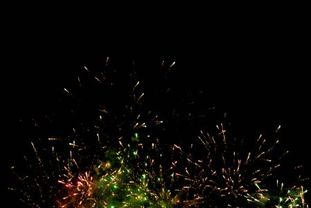 Colorful fireworks on the black sky background. Celebration.の写真素材