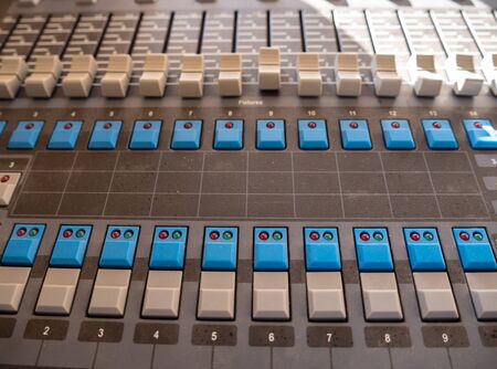 Sound mixer control panel with sliders and buttons closeup view. Selective focus.の写真素材
