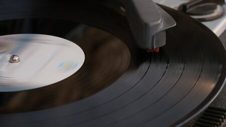 Close up of a Vinyl Record Playing on a Turntable. Stylus needle on vinyl record playing.の写真素材