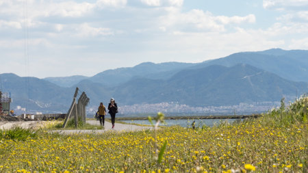 Izmir, Turkey - April, 2017: city of izmir with people walking seashore.のeditorial素材