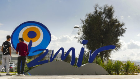 Izmir, Turkey - October 7, 2017: Sign with the logo of the city of Izmir in front of the Konak ferry terminal.のeditorial素材