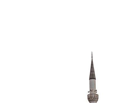 Minaret of a Muslim mosque on isolated white background. minaret aspiring to heaven.の写真素材