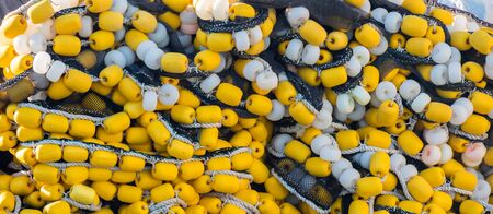 Close-up of fishing net and floats background. fishing industry.