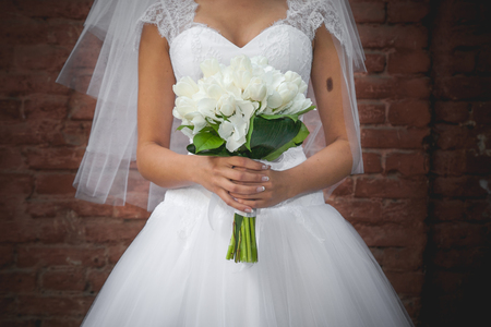 The bride holds wedding bouquetの写真素材