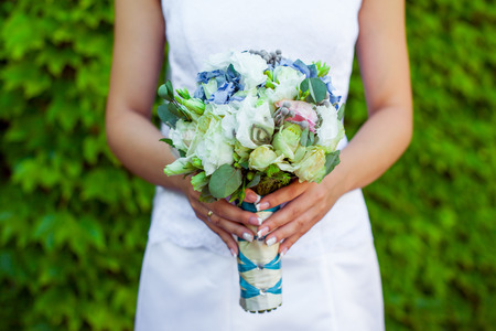 The bride holds wedding bouquetの写真素材
