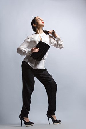 Fashion photo of young magnificent woman. Girl posing. Studio photoの写真素材