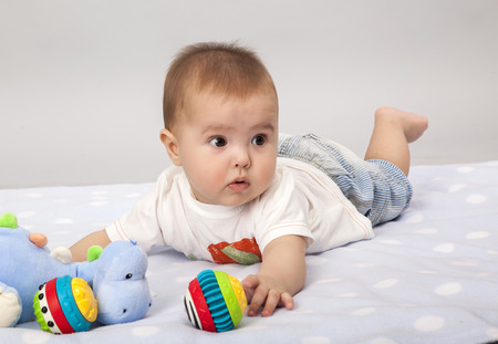 beautiful little baby , lie on stomachの写真素材