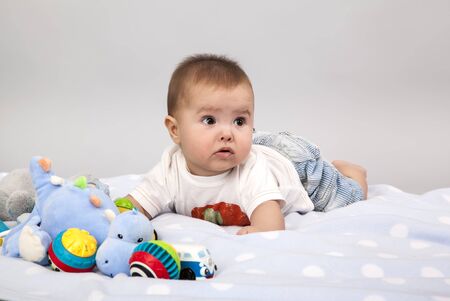 beautiful little baby , lie on stomachの写真素材