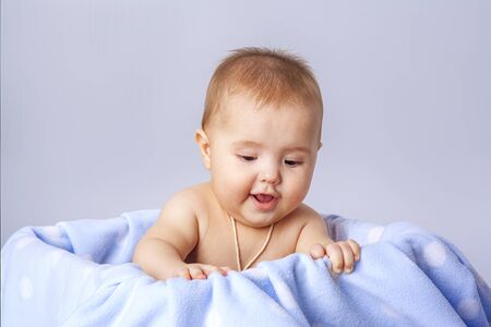 little cute baby  lying in basketの写真素材