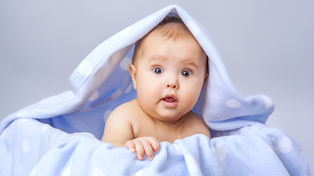 little cute baby  lying in basketの写真素材