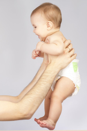 young father holding babyの写真素材