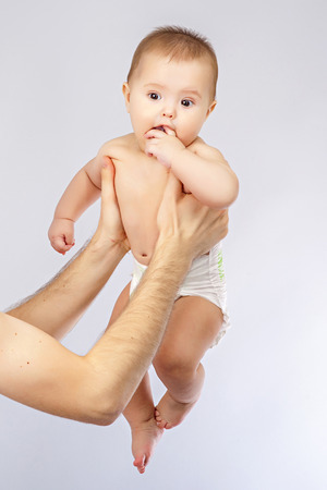 young father holding babyの写真素材