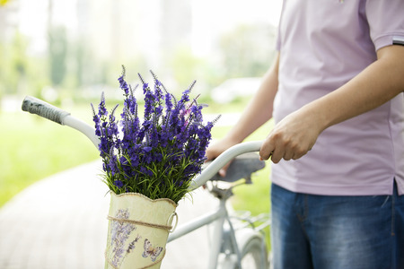 Man with the bike on the grassの写真素材