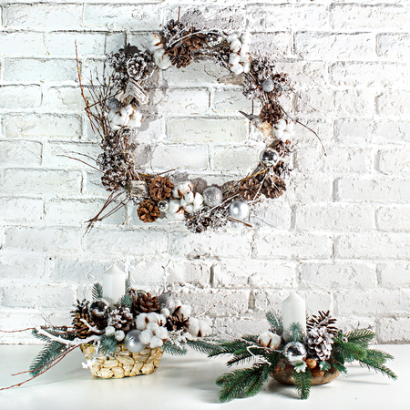 the Christmas wreath against a white brick wallの写真素材