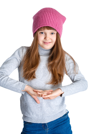 adorable smiling child girl wearing pink knitted hatの写真素材