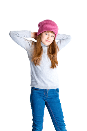 adorable smiling child girl wearing pink knitted hatの写真素材