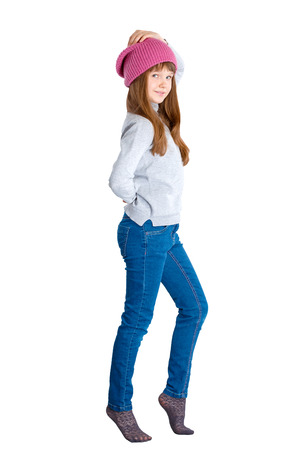 adorable smiling child girl wearing pink knitted hatの写真素材