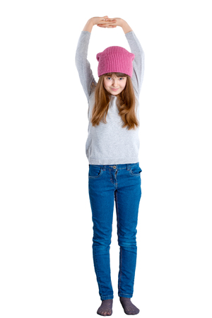 adorable smiling child girl wearing pink knitted hatの写真素材