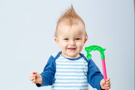 beautiful little baby in the blue striped shirt
