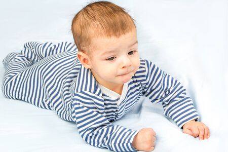 the beautiful little baby, lie  on stomachの写真素材