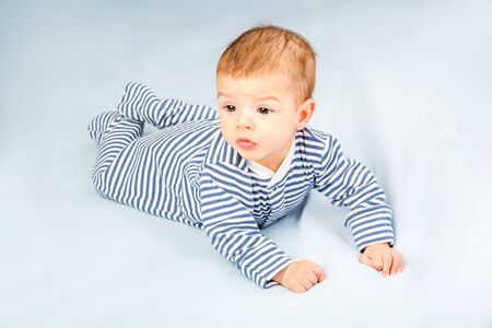 the beautiful little baby, lie  on stomachの写真素材