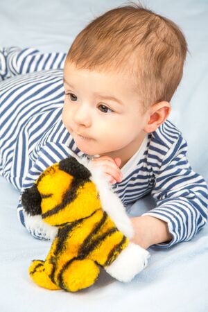 the beautiful little baby, lie  on stomachの写真素材