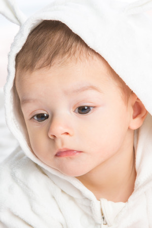 the beautiful little baby, lie  on stomach  on towelの写真素材