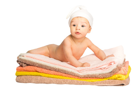 the baby on the colorful towels stackの写真素材