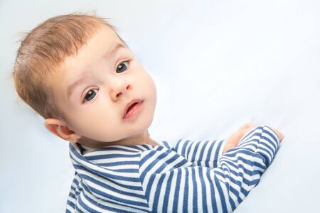 the beautiful little baby, lie  on stomachの写真素材
