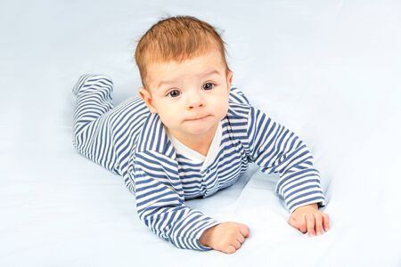 the beautiful little baby, lie  on stomachの写真素材