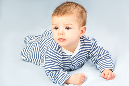 the beautiful little baby, lie  on stomachの写真素材
