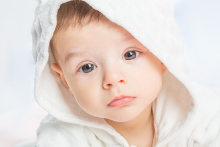 the beautiful little baby, lie  on stomach  on towelの写真素材