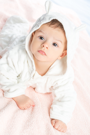 the beautiful little baby, lie  on stomach  on towelの写真素材