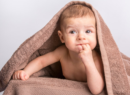 the little beautiful  baby under the towelの写真素材