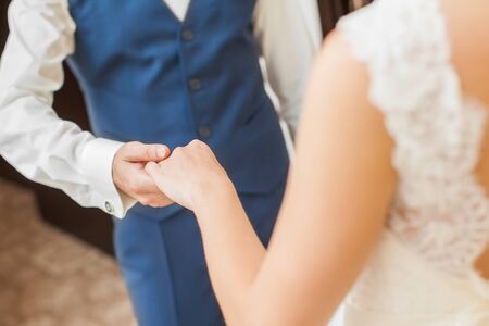 Wedding couple holding hands. bride and groom