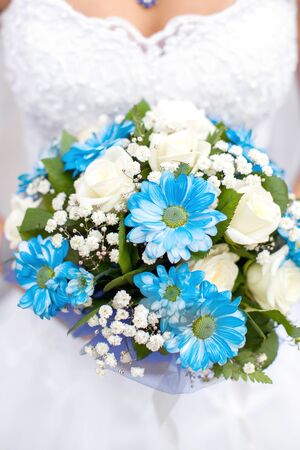 The bride holds the beautiful wedding bouquetの写真素材