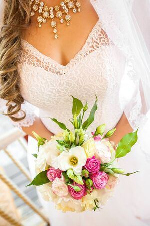 The bride holds the beautiful wedding bouquetの写真素材