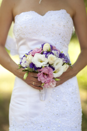 The bride holds the beautiful wedding bouquetの写真素材