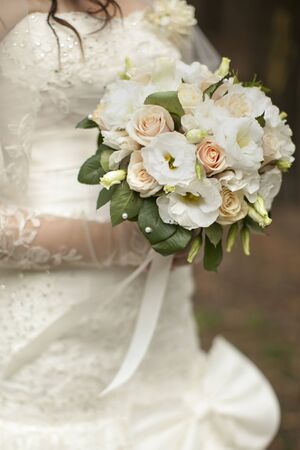 The bride holds the beautiful wedding bouquetの写真素材