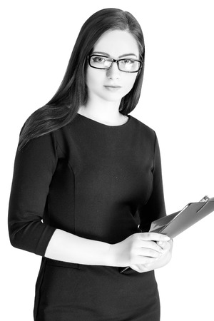 Portrait of  businesswoman in glasses with  folder isolated on white backgroundの写真素材