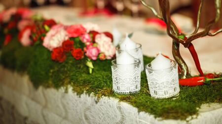 white candles on the green grassの写真素材