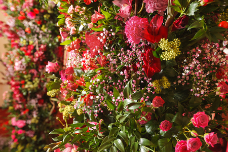 red roses and carnations in the party decorationsの写真素材